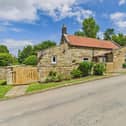 The attractive stone property for sale in the village of Ugglebarnby.
