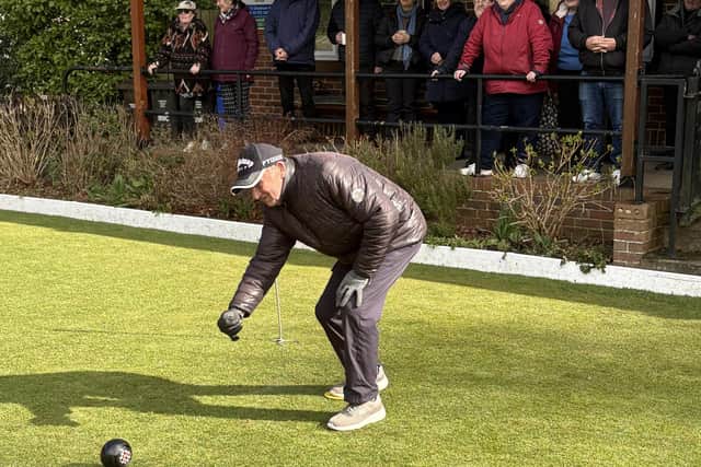 Borough President Pete Hodgson bowling the first woods of the new season