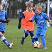 Hawks (blue kit) take on Brooklyn (bibs). Photo: Cherie Allardice