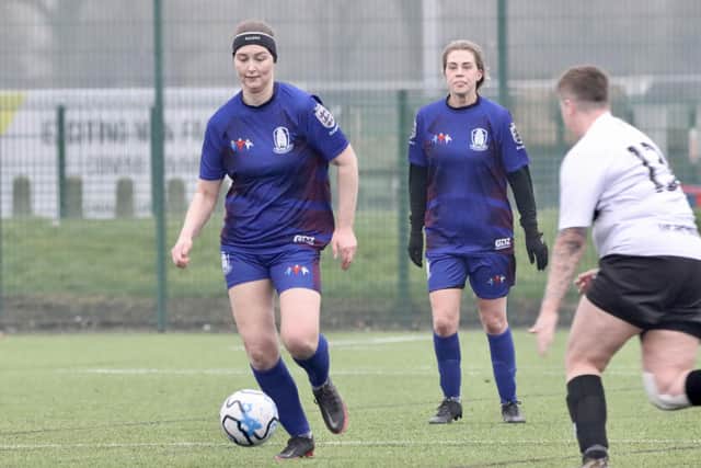 The home side charge forward during the league encounter.