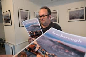 John Westgarth ready with his photographic work.