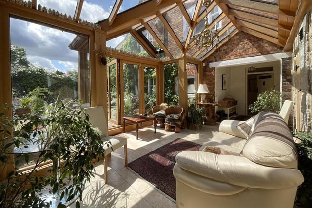 A relaxing sun room looks over the garden.