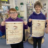 Hawsker-cum-Stainsacre pupils advertising the community coffee event.