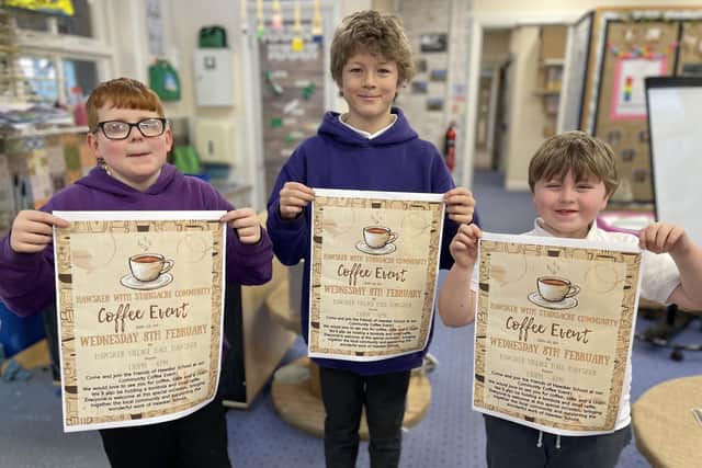 Hawsker-cum-Stainsacre pupils advertising the community coffee event.