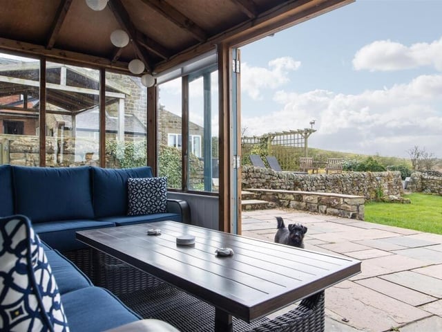 The summerhouse and patio have uninterrupted views.