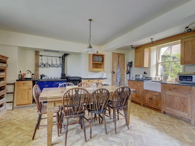 A large, well equipped farmhouse-style dining kitchen.