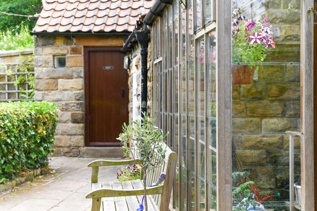 There is a useful range of stone outbuildings and a hardwood greenhouse.