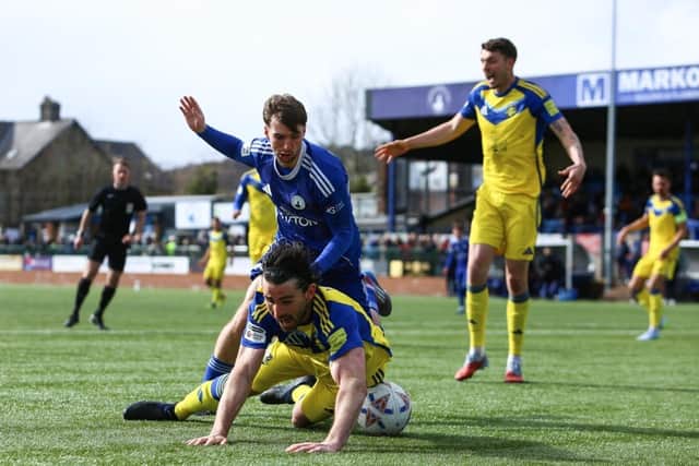Boro midfielder Alex Purver appears to be fouled in the area at Buxton, but no penalty was awarded, with the visitors 1-0 down at the time. Photo by Zach Forster