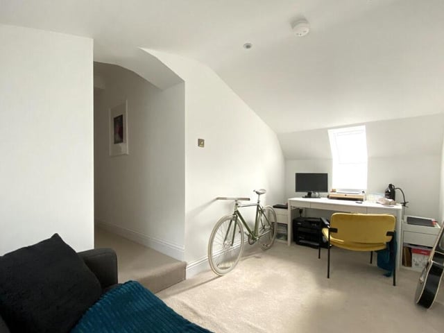 A versatile room suitable as a home office or a dressing room.