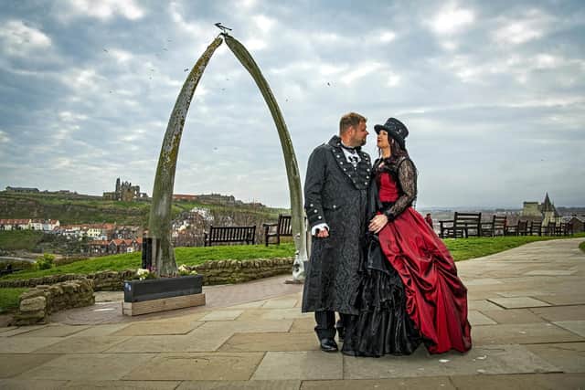 Kelly and David Webster from Wakefield pause by famous whale bones in Whitby.