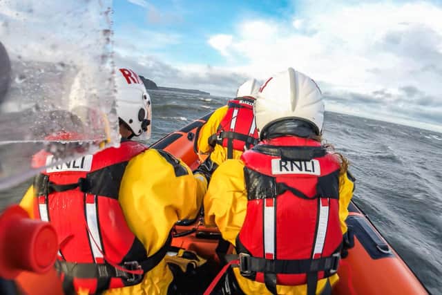 Staithes and Runswick Lifeboat crew at sea - Image: James Stoker/RNLI