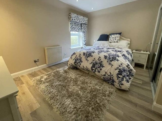 One of three bedrooms within the apartment, all of which have mirrored wardrobes.
