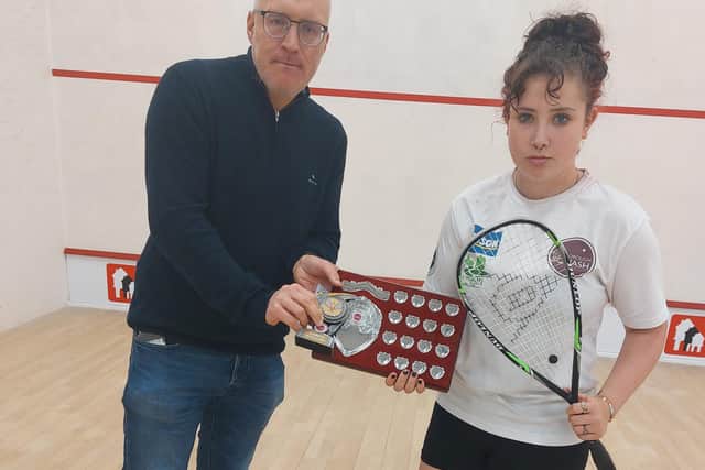Scott McCabe presents Livvy Miners with the ladies champion shield.