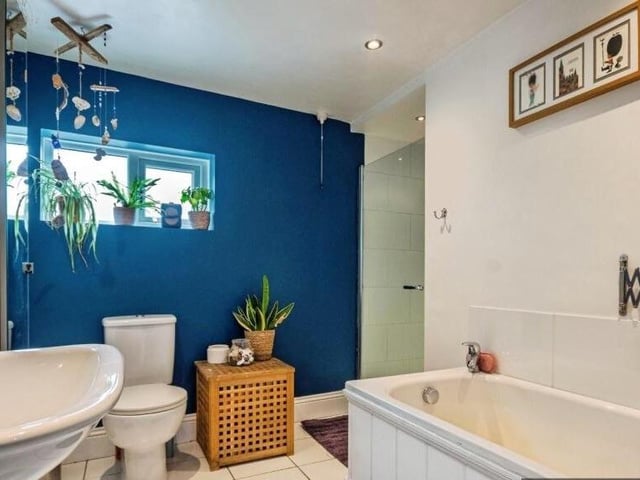 The stylish bathroom is on the ground floor.