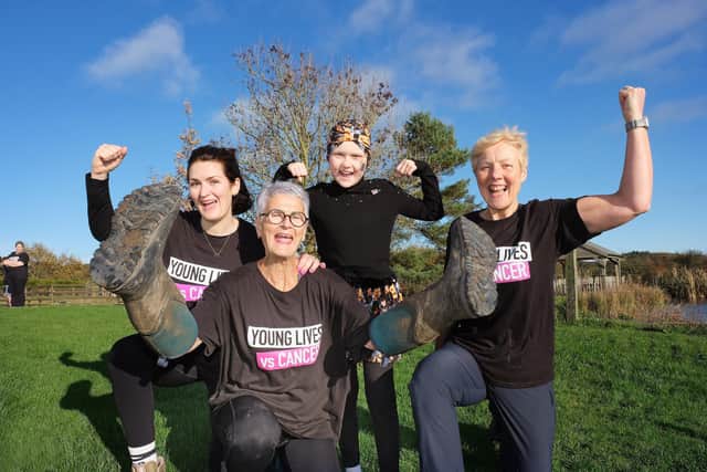 Bryony Jackson, Nicky Hurrell, Isla Byrne and Sally Alexander cheer after finishing their charity walk in October