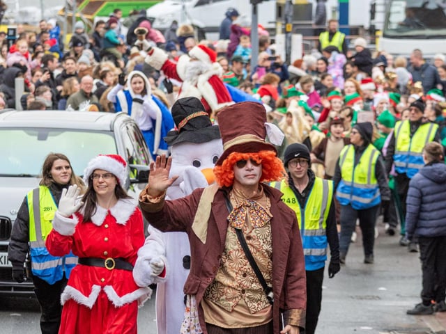 Santa waves to the crowd.