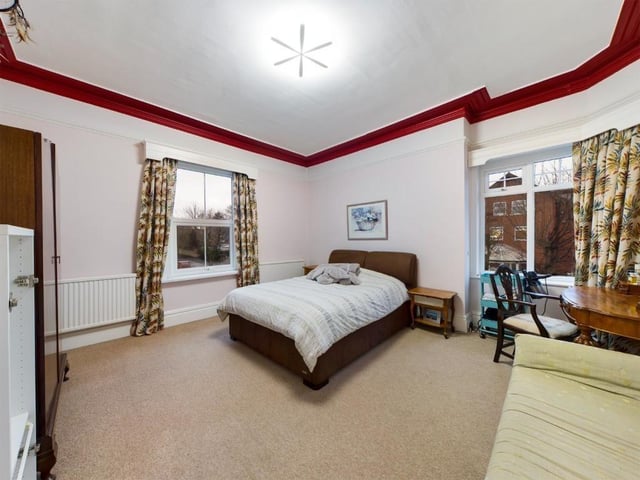 Another of the spacious double bedrooms, this one with a bay window.