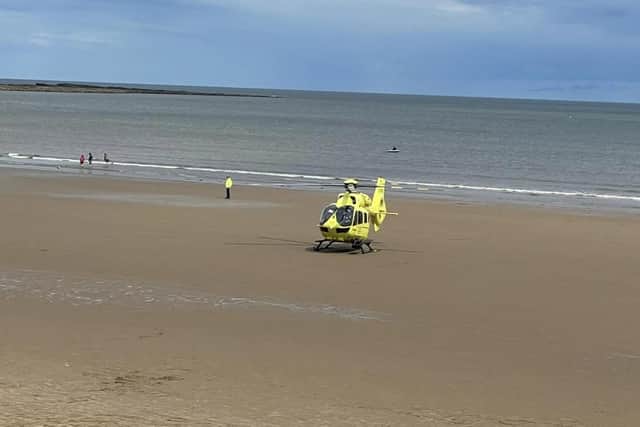 Yorkshire Air Ambulance lands on the beach at Filey Brigg.