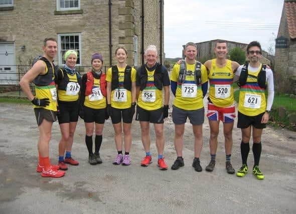 Scarborough Athletic Club's team line up before the Saltergate Gallows fell race.
