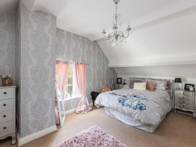 This inviting room with a deep window sill has plenty of space for free standing furniture of choice.