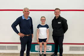 Chris West, left, and Ollie West, of West Building Supplies, right, have become one of the main sponsors of Bridlington squash star Hattie Langley, centre.