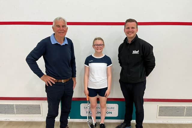 Chris West, left, and Ollie West, of West Building Supplies, right, have become one of the main sponsors of Bridlington squash star Hattie Langley, centre.