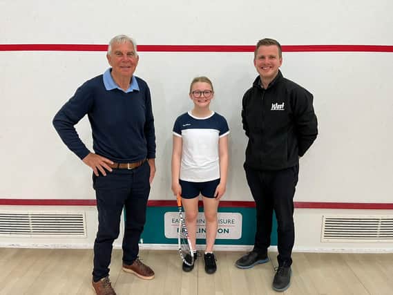 Chris West, left, and Ollie West, of West Building Supplies, right, have become one of the main sponsors of Bridlington squash star Hattie Langley, centre.