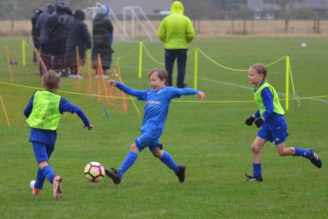 Heslerton Hawks U8s take on Old Malton. Photo by Cherie Allardice