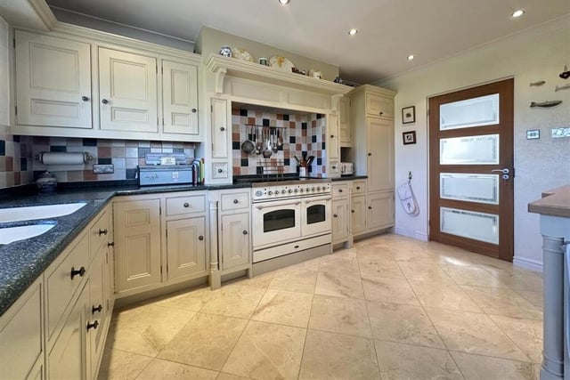 The well equipped kitchen opens through to a breakfast room.