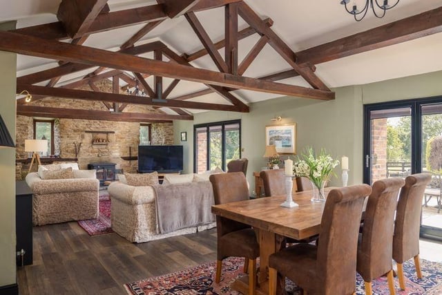 A rustic, stylish interior with open vaults and exposed brick wall.