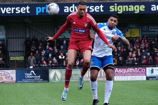 Athletic's loan striker Kole Hall battles for the ball.
