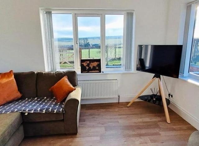 Lounge space with open views through double glazed windows.