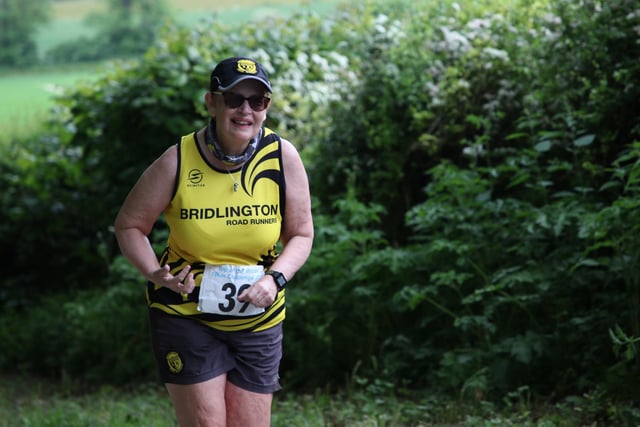 A Bridlington Road Runners is all smiles at the Top of the Wolds 10K Challenge.