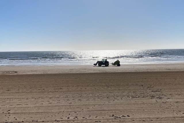 Ian Sandy framed this super photograph of the beach tractor.