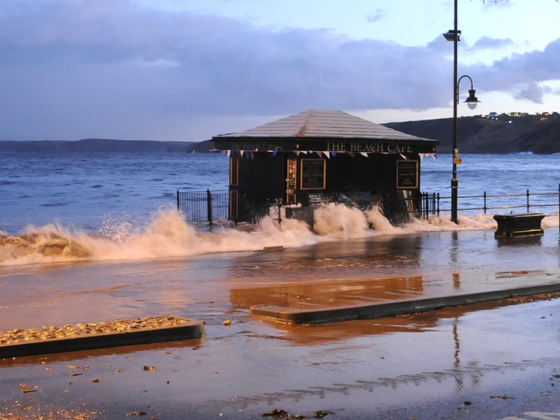 Waves come in past the Beach Cafe, Scarborough.