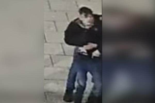 Police want to speak to the man in this CCTV image after a shop window was damaged in Scarborough.