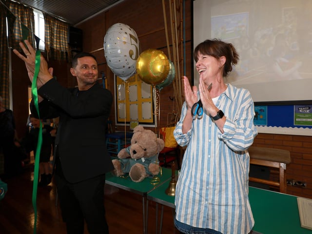 Newly retired teacher Joanne Hartley cutting the ribbon