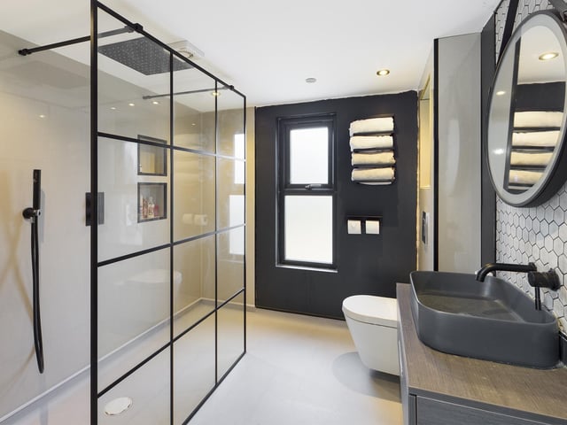 The walk-through shower is a feature of this bathroom within the property.