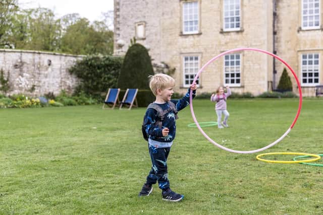 Visitors playing outdoor games during the Festival of Blossom event at Nunnington Hall, North Yorkshire