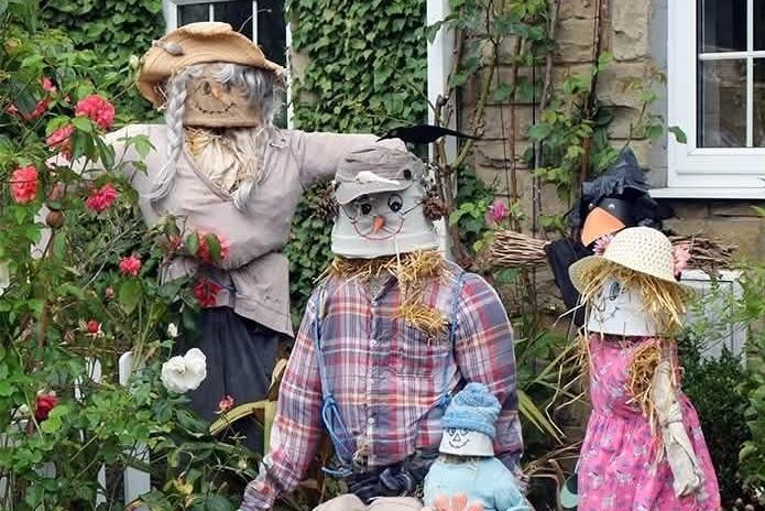 A scarecrow family on the trail.