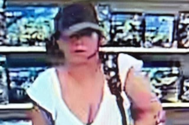 A CCTV image of a woman police need to identify following incidents involving counterfeit bank notes in Filey.