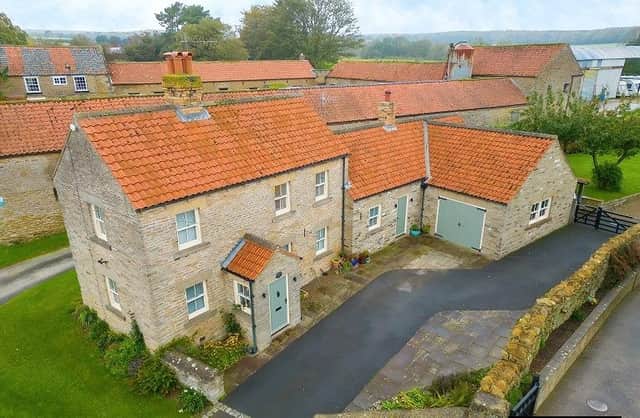 The cottage has a stunning location within the village of Sawdon.