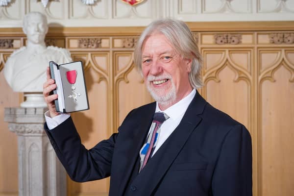John Oxley pictured with his MBE.