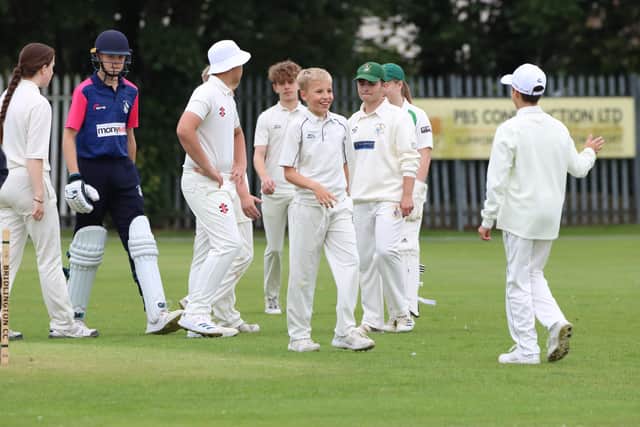 Bridlington U15s celebrate claiming a Wykeham wicket.