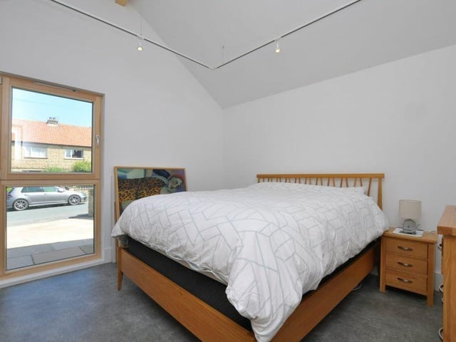 The bedroom in the extension has an en suite shower room, and is a fourth bedroom in the property.