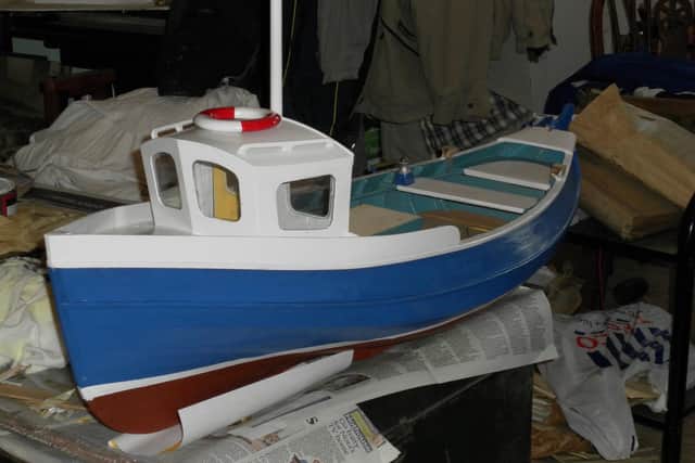 As Joe retired from building large boats, he built model cobles instead.