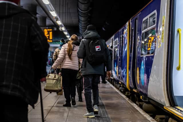 Passengers boarding a Northern train.