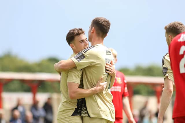 Luca Colville congratulates Dom Tear after one of his goals at Brid Town.