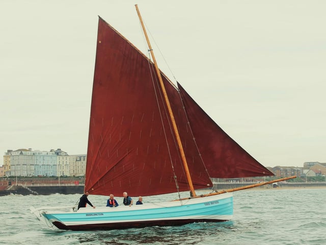 Three Brothers under full sail in the Bay.