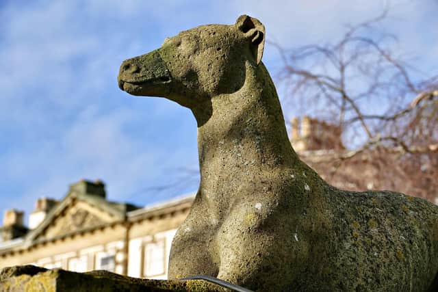 Aled Jones focuses on a weathered statue at Sewerby Hall.